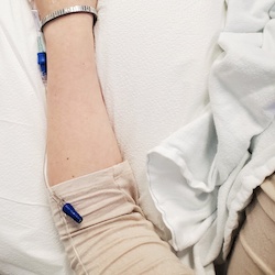 A lupus patient's arm with the IV for a benlysta infusion