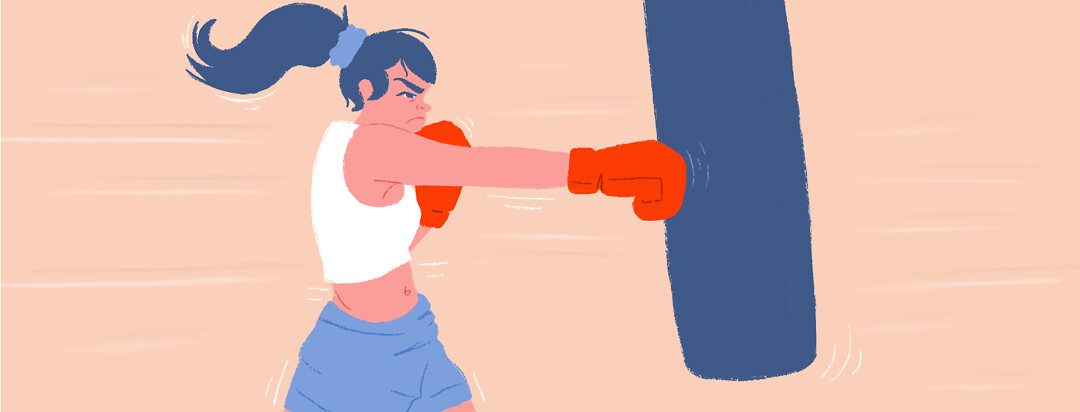 A female boxer punching the bag.
