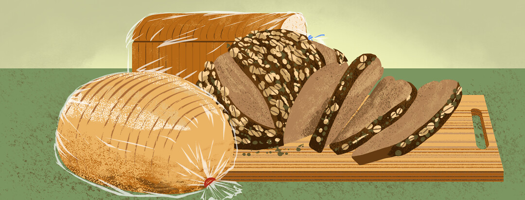 A spread of loaves of bread on a cutting board.