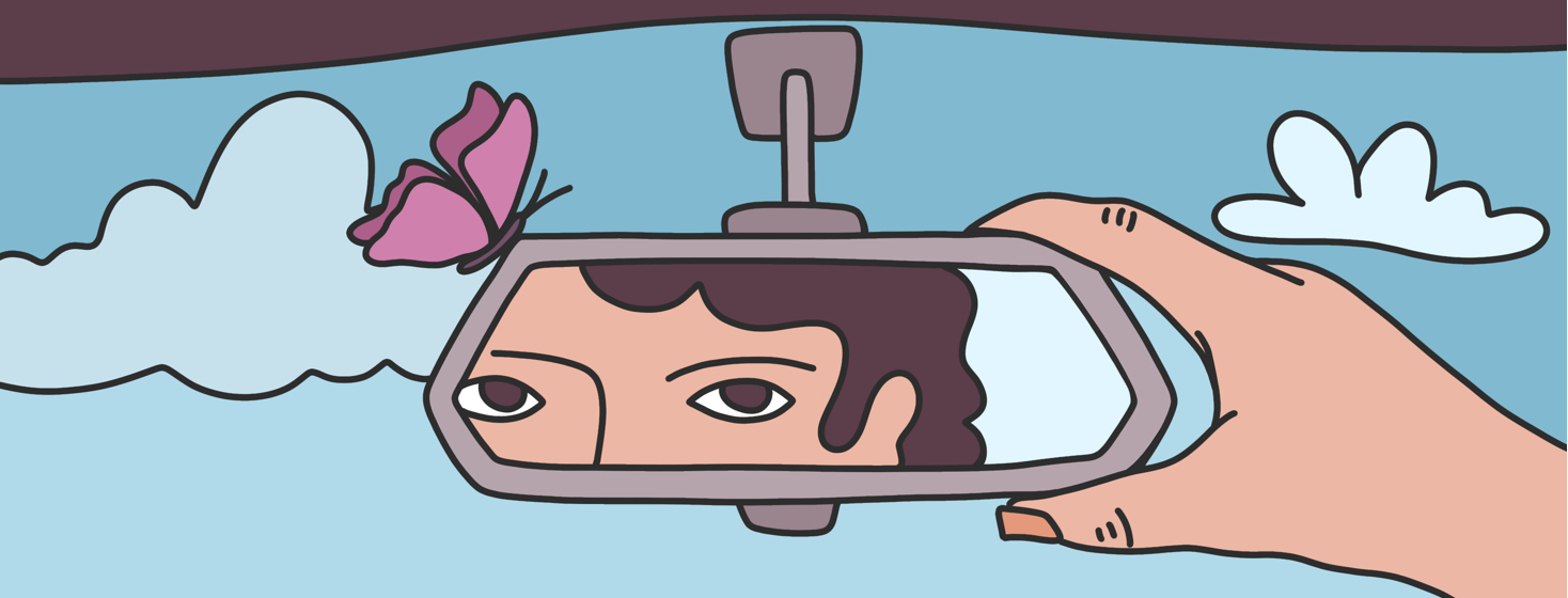 A person looking in their reflection in the rearview mirror of a car with a butterfly resting on the rim of the mirror.