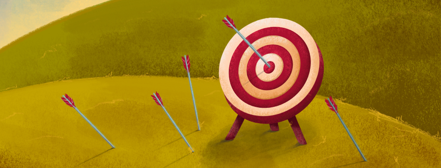 A target is shown in a grassy hillside with several arrows missing and one hitting the bullseye.