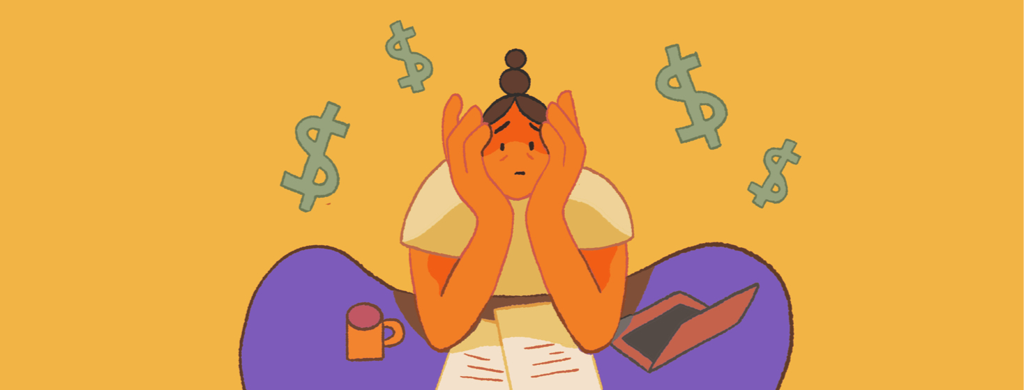 A worried woman sits at a desk with dollar signs floating above her head.