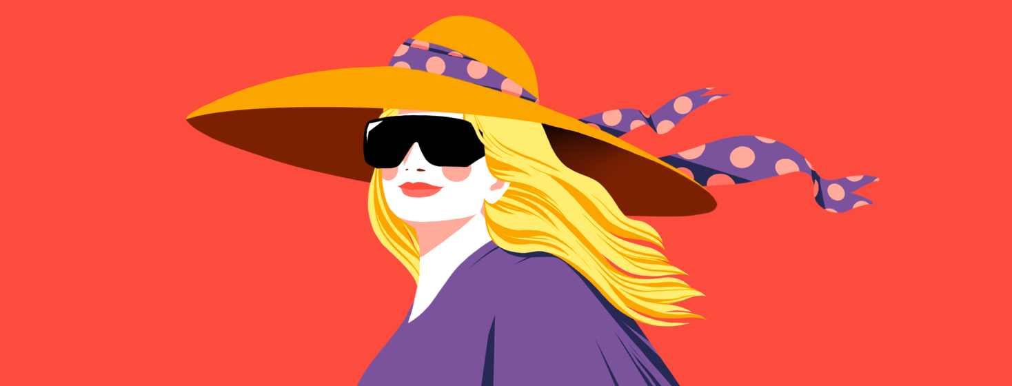A woman wearing sun protection including a floppy hat, sunglasses, and long sleeves.