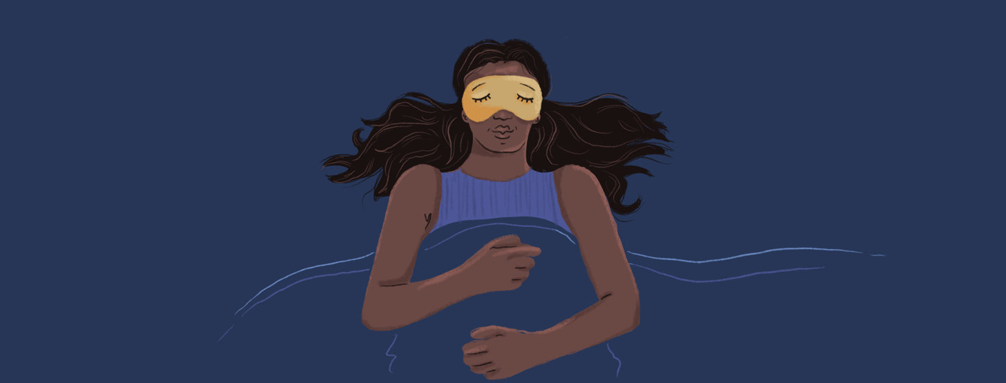 A woman sleeping soundly with an eye mask on.