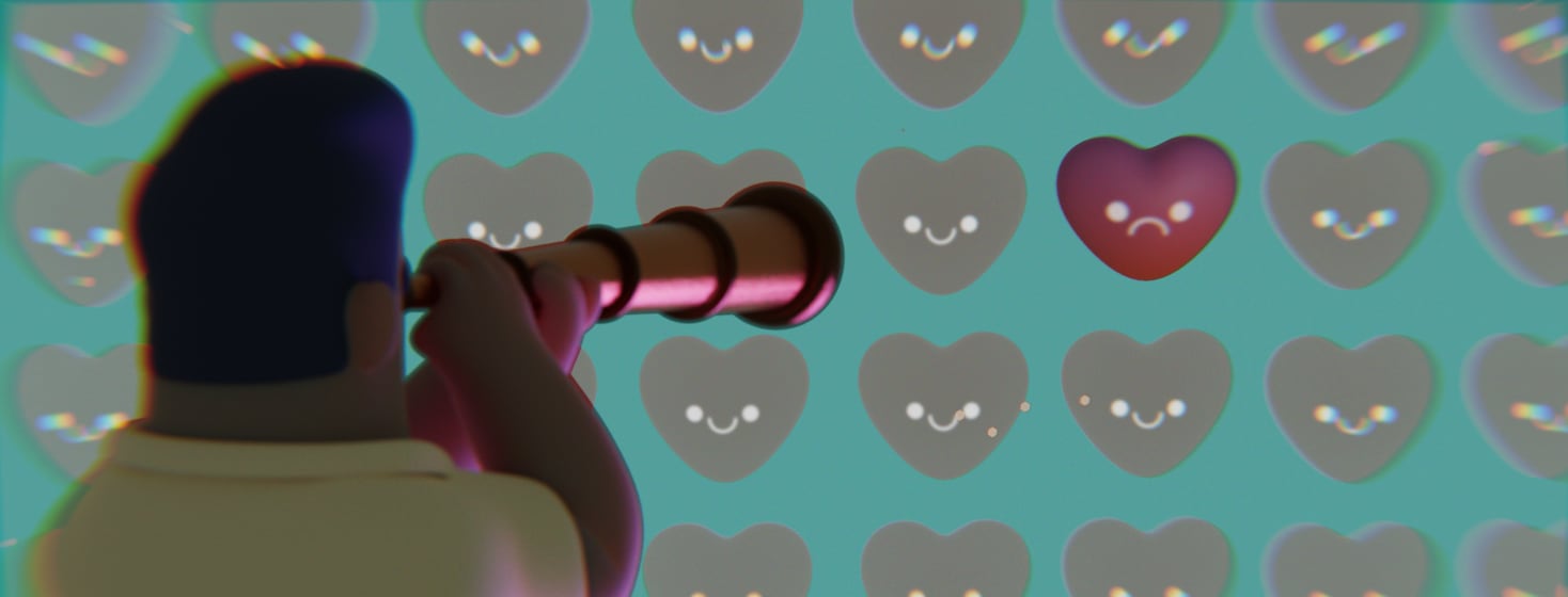 A person looking off into the distance through a telescope at a whole wall of happy hearts except for one sad discolored heart.